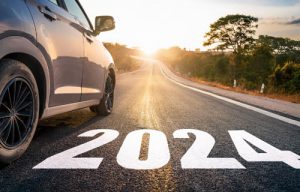 Intro image. Car with 2024 written on the road.