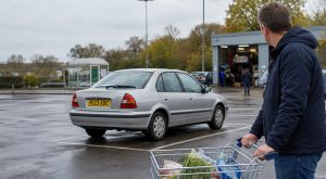 olded scrapped car in tesco car park